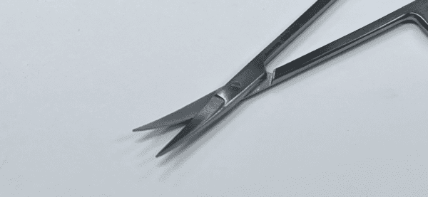 An IRIS SCISSOR on a white surface.