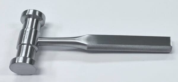 An orthopedic handle on a white surface.