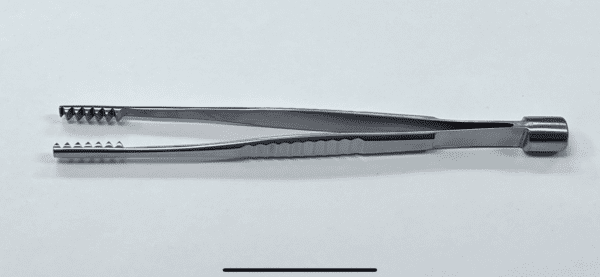 A pair of BONE IMPACT/GRAFT FORCEP on a white surface.