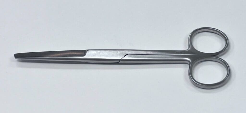 A pair of OPERATING SCISSOR SHARP/BLUNT on a white surface.