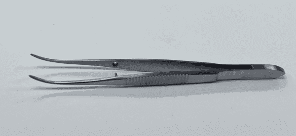 A pair of IRIS FORCEP tweezers on a white surface.