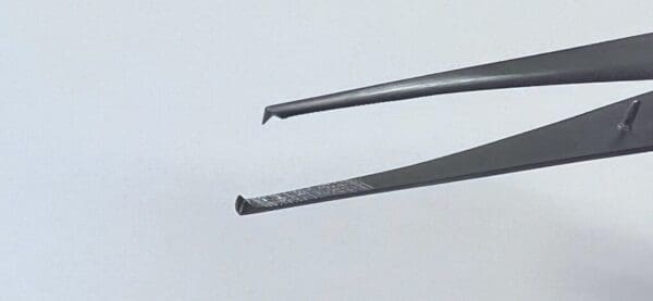 A pair of Gillies Tissue Forceps with a black handle.