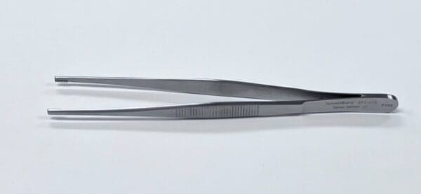 A pair of brown tissue forceps on a white surface.