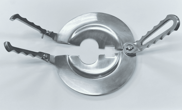 A stainless steel plate with a PERCY AMPUTATION SHIELD on it.