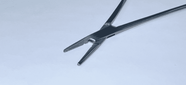 A CRILEWOOD NEEDLE HOLDER on a white surface.