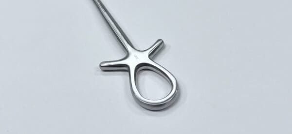 A MURPHY RETRACTOR on a white surface.