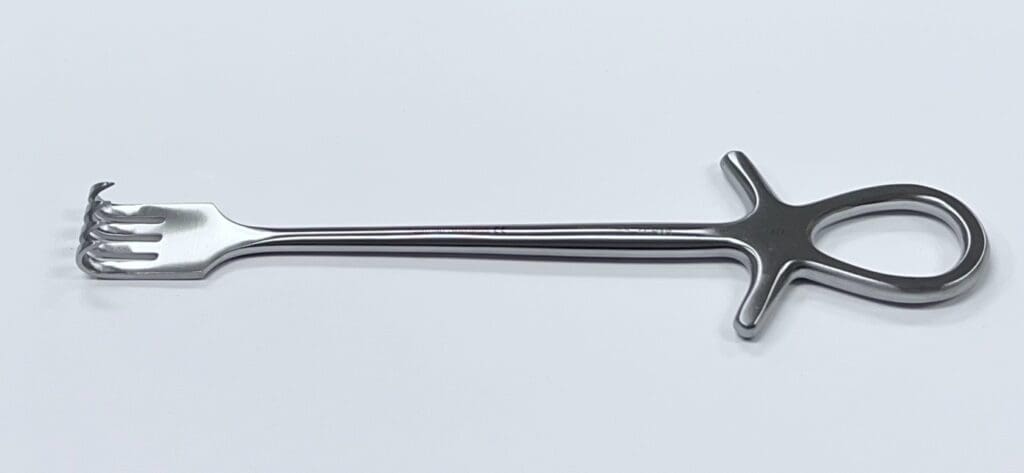 A Murphy retractor with a handle on a white surface.