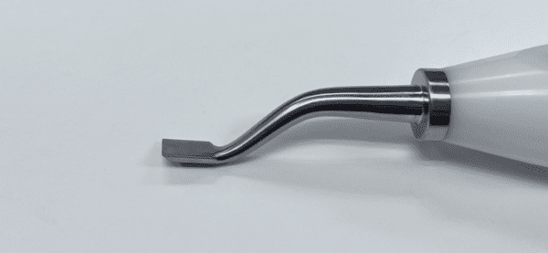 A MORELAND TYPE INTERCONDYLAR FEMORAL CHISEL with a metal handle on a white surface.