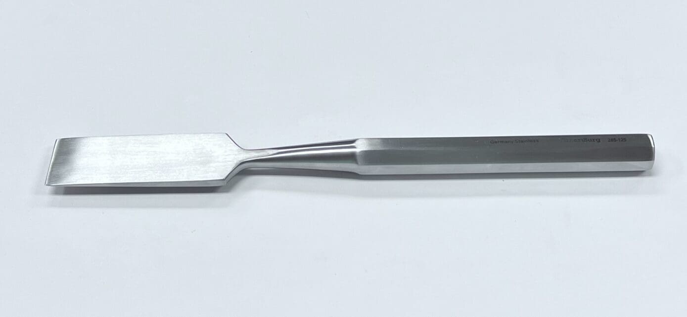 A HIBBS OSTEOTOME with a metal handle on a white surface.