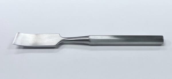 A HIBBS OSTEOTOME tool on a white surface.