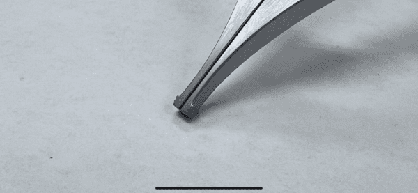 An image of a Cloward Style Lamina Spreader on a white surface.