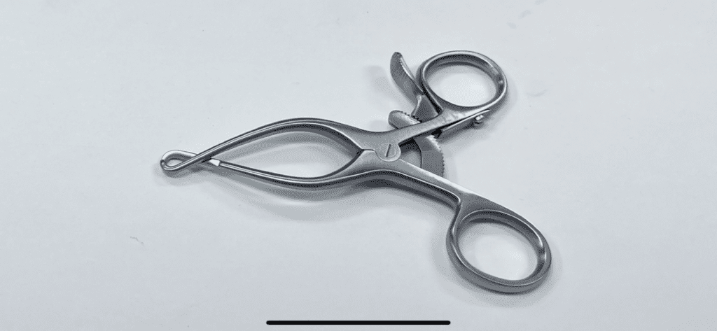 A HENDREN TYPE NEUROMA RETRACTOR on a white surface.