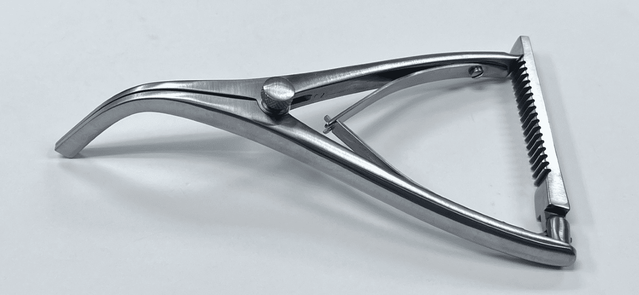 An ORTHOPEDIC SELF-RETAINING RETRACTOR laying on a white surface.