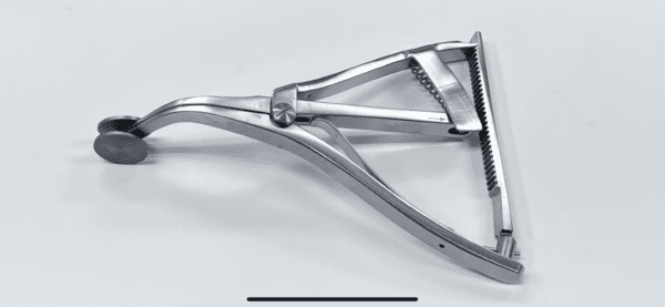 A picture of a FEMORAL TIBIAL TENSOR/SPREADER, SCOTT TYPE on a white surface.
