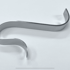 A metal S TOTAL KNEE RETRACTOR on a white surface.