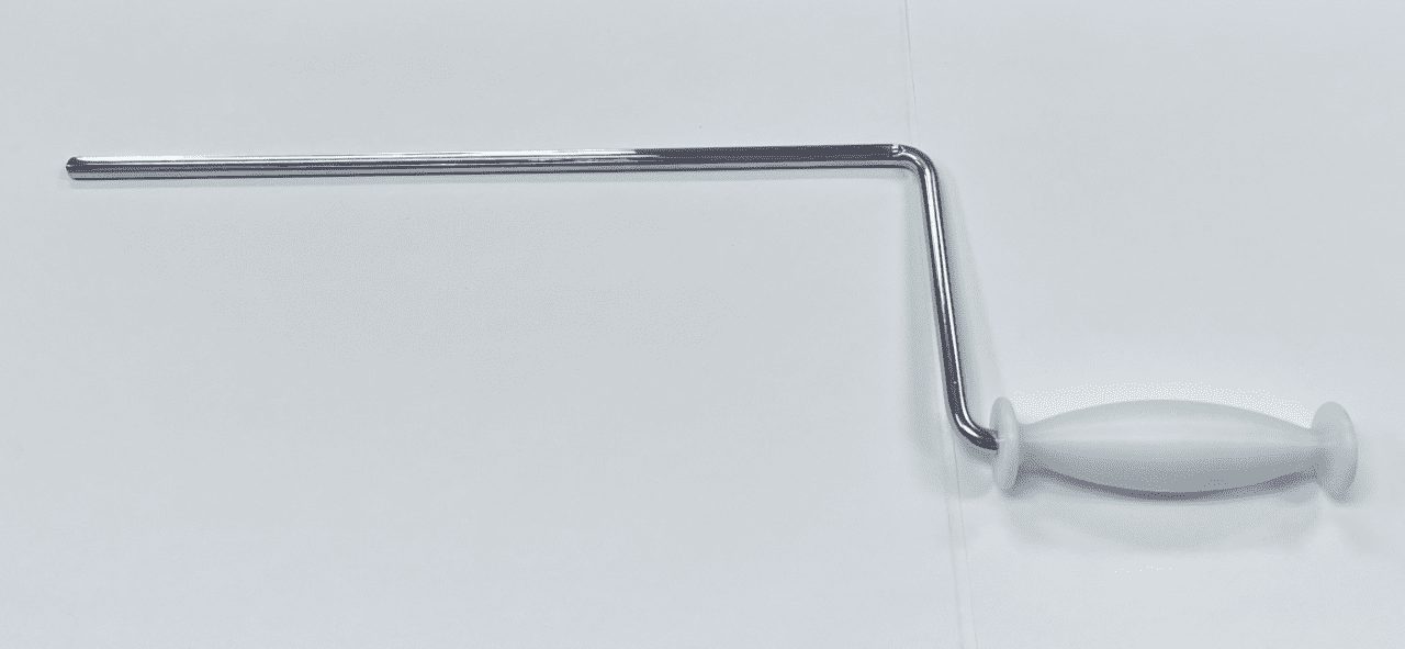 A DISTAL FEMUR DISTRACTOR on a white wall.