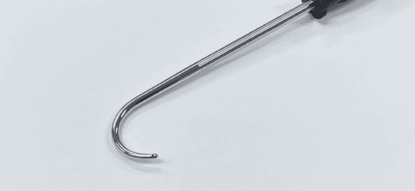 A BONE HOOK WITH ERGONOMIC HANDLE with a black handle on a white surface.