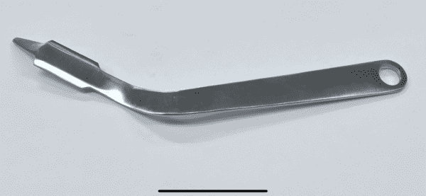 A stainless steel PENENBERG TYPE GLUTEUS RETRACTOR with a handle on a white surface.