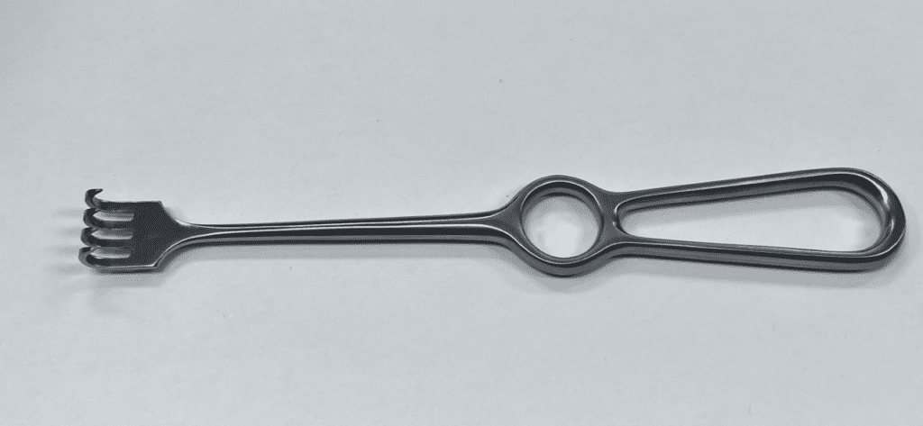 A VOLKMANN RETRACTOR, SHARP with a handle on a white surface.