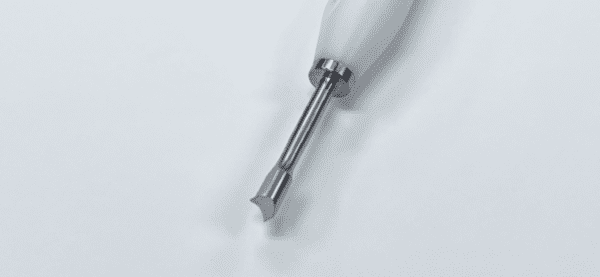 A white MORELAND TYPE FEMORAL/TIBIAL EXTRACTOR with a metal handle on a white surface.