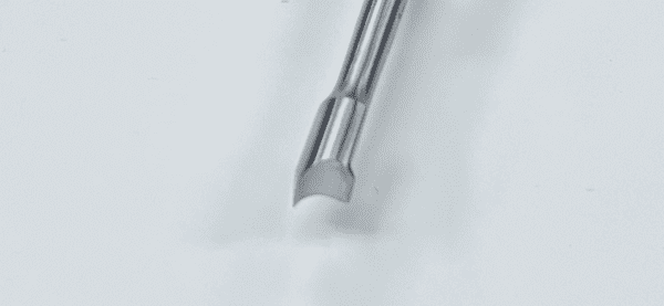A Moreland Type Femoral/Tibial Extractor is sitting on top of a white surface.