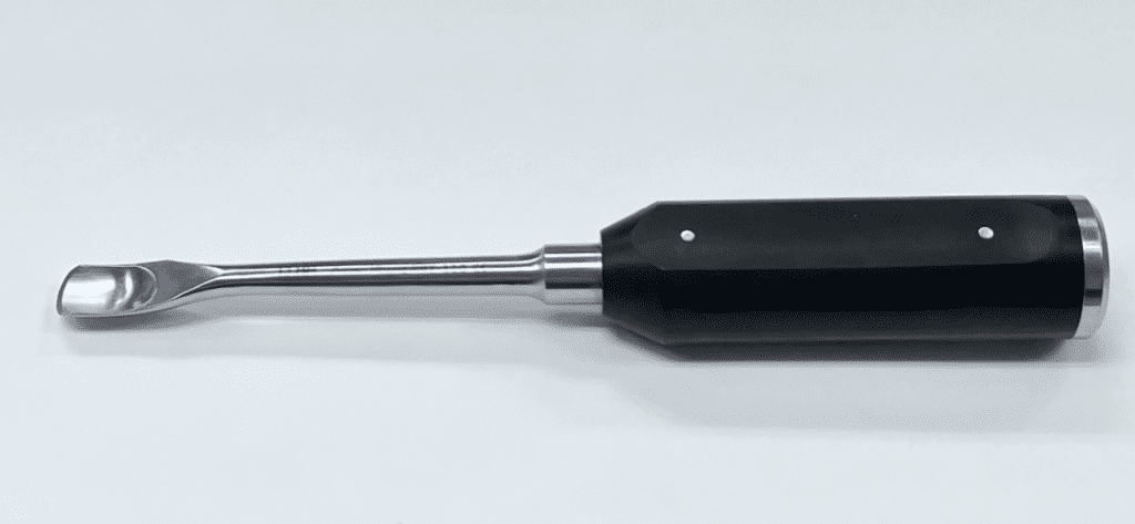 A black and silver CAPENER LAMINA GOUGE on a white surface.