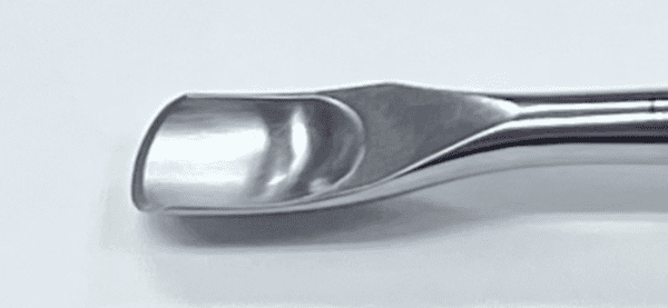 A Capener Lamina Gouge on a white surface.