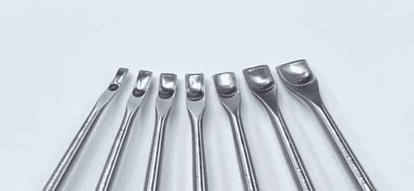 A set of CAPENER LAMINA GOUGE dental tools on a white surface.