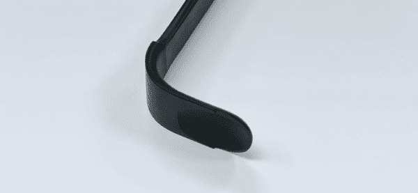 A close up of a BROWN DELTOID RETRACTOR, RADIOLUCENT, MODIFIED on a white surface.