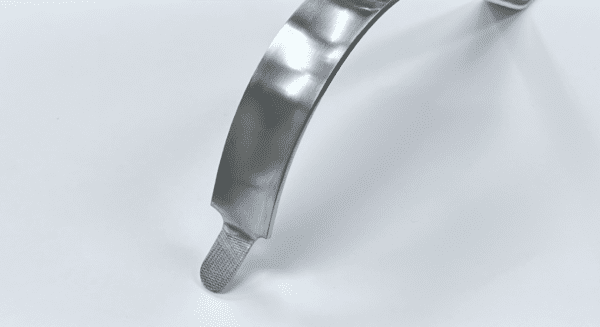 A piece of COBRA RETRACTOR, NARROW, BLUNT, UNGER TYPE on a white surface.