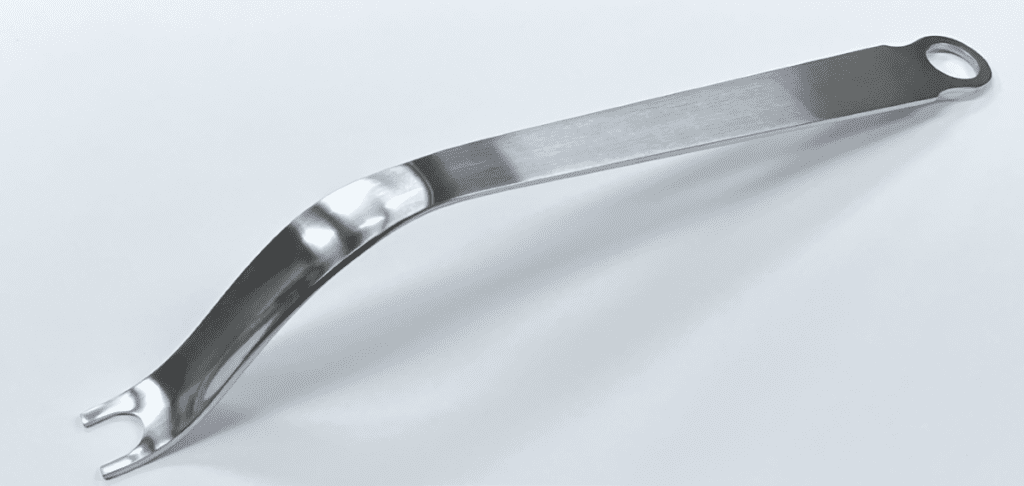A FEMORAL NECK ELEVATOR, LONG PRONG, UNGER TYPE on a white surface.