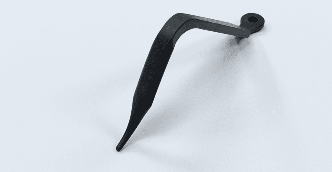 A HOHMANN RETRACTOR, BENT, RADIOLUCENT handle on a white surface.