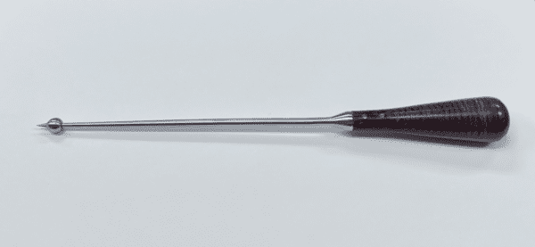A black and silver BALL SPIKE WITH BELL HANDLE on a white surface.