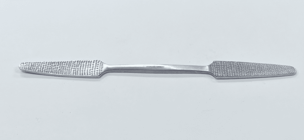 A silver RASP handle on a white surface.