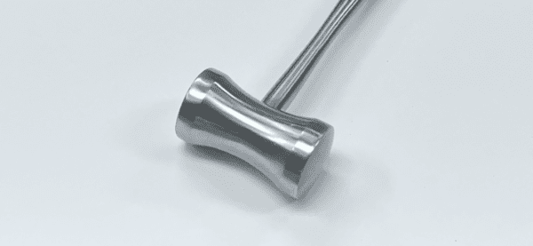 A MALLET, HAJEK handle on a white surface.