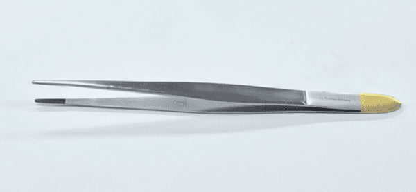 A TC CUSHING TISSUE FORCEP on a white surface.