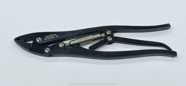 A black SPINAL ROD GRIPPER on a white surface.