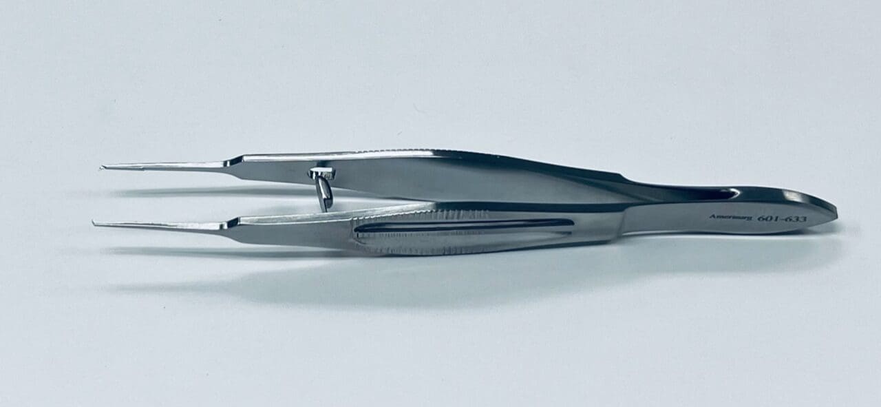 A STERN-CASTROVIEJO SUTURE FORCEP on a white surface.