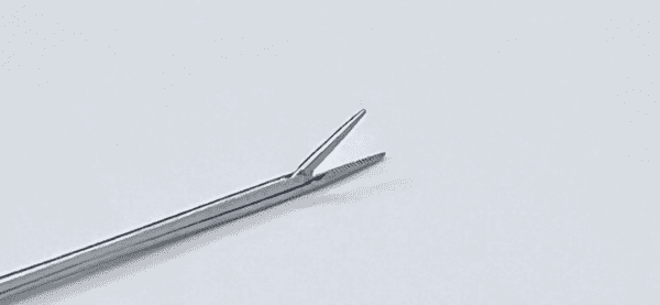 A BELLUCCI ALLIGATOR FORCEP on a white surface.