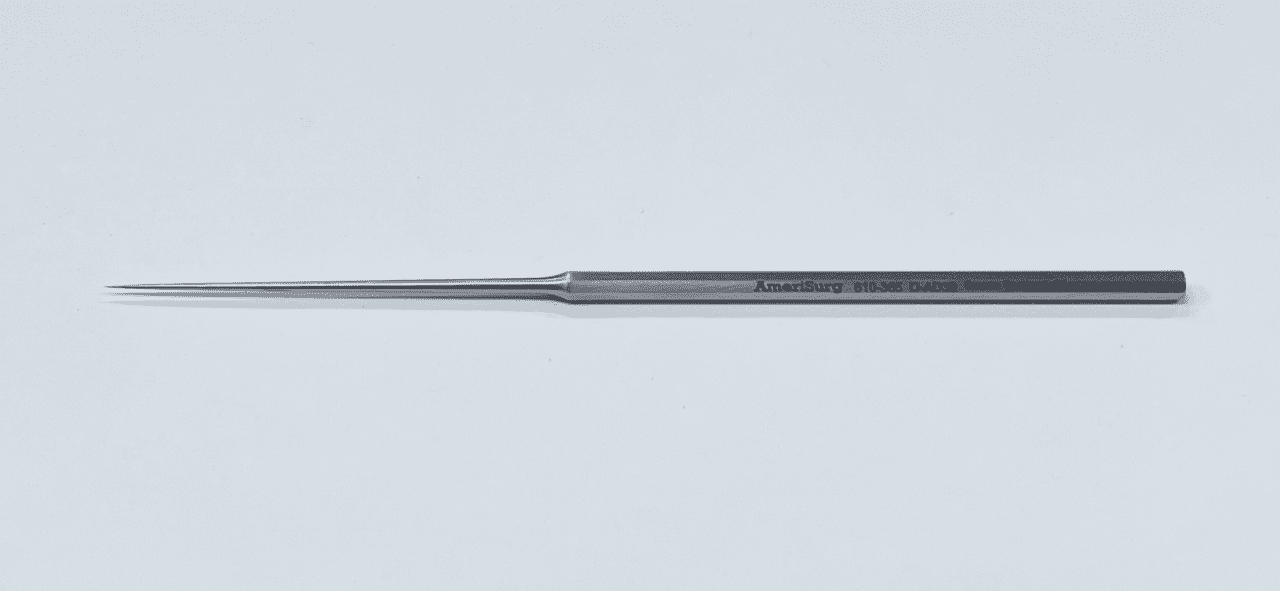 A Metallic Pick Placed on a White Background