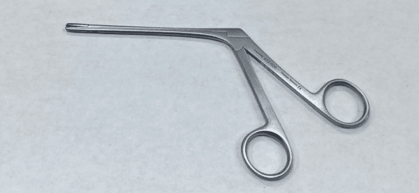 A pair of Takahashi forceps on a white surface.