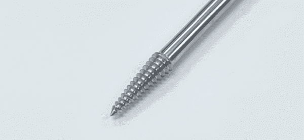 A stainless steel femoral head extractor on a white surface.