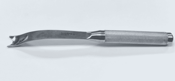 A silver femoral neck elevator with a handle on a white surface.