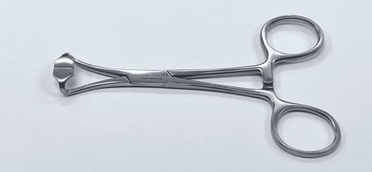 A NON-PERFORATING TOWEL CLAMP on a white surface.