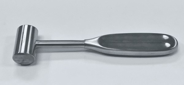A stainless steel GERZOG handle on a white surface.