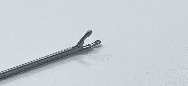 A pair of OVAL CUP FORCEP on a white surface.