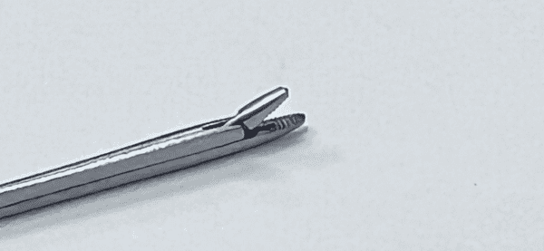 A HOUSE MINI FORCEP on a white surface.