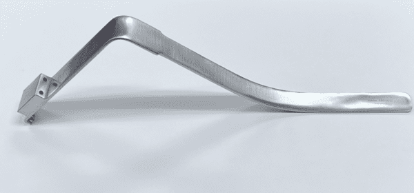 A SUPERIOR RETRACTOR handle on a white surface.