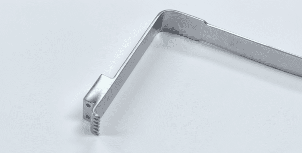 A SUPERIOR RETRACTOR on a white surface.