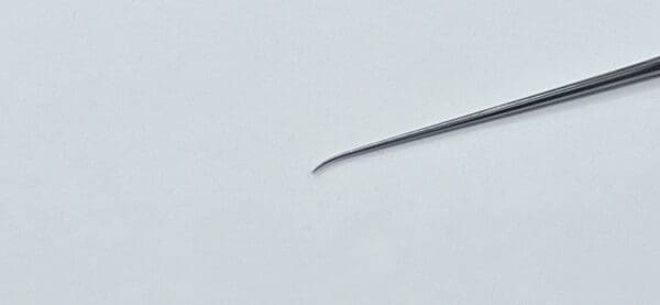 A close up of a HOUSE-ROSEN TYPE NEEDLE.